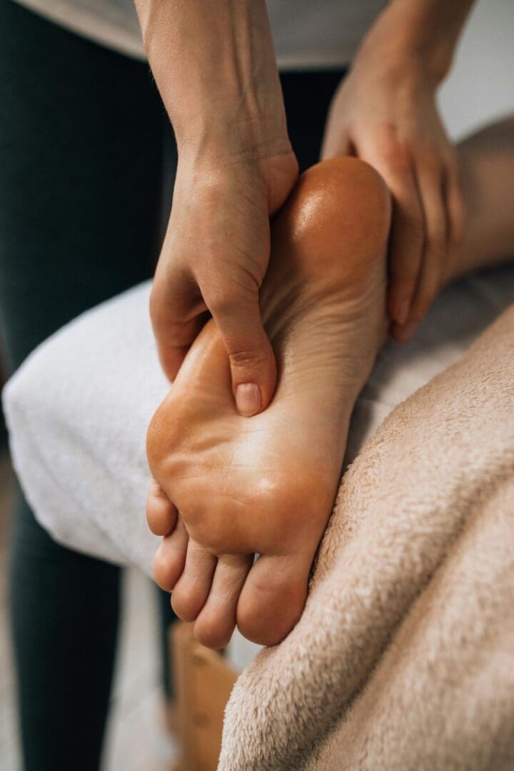 Person receiving a relaxing foot massage.