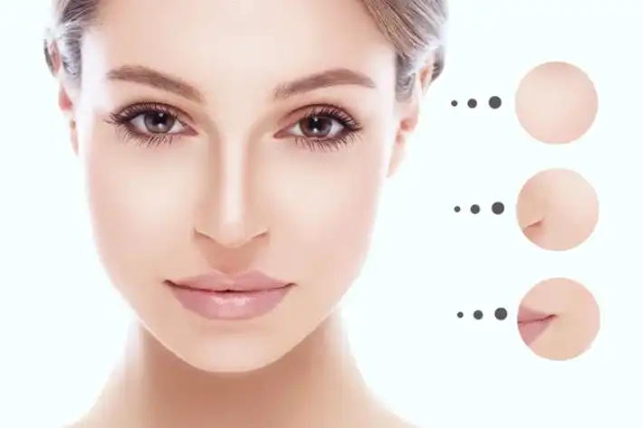 A woman with clear skin and makeup foundation shades beside her face.